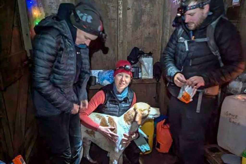 Clëo Bishop-Bolt with the dog in the mountain refuge hut. Photo: NNPMRT