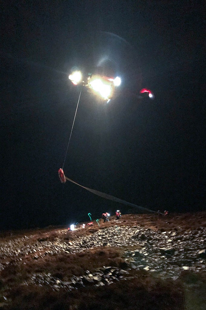 The injured walker is winched into the helicopter. Photo: Aberdyfi SRT