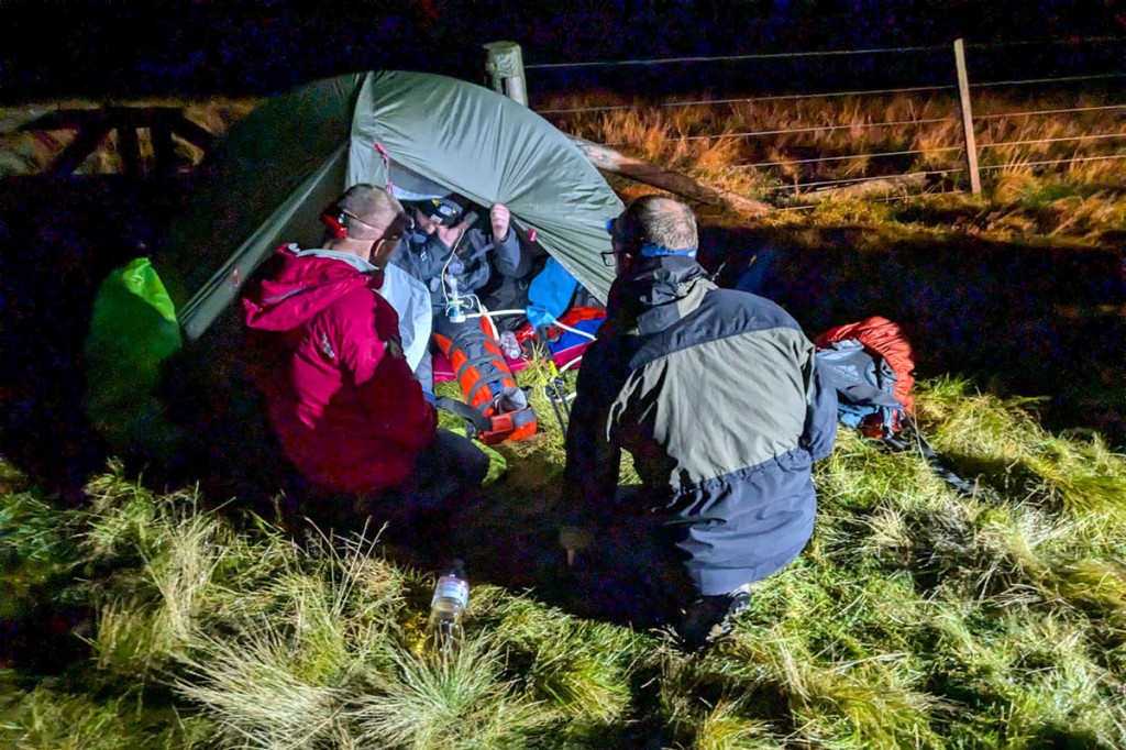 Rescuers splint the walker's leg on the Border Ridge. Photo: BSARU