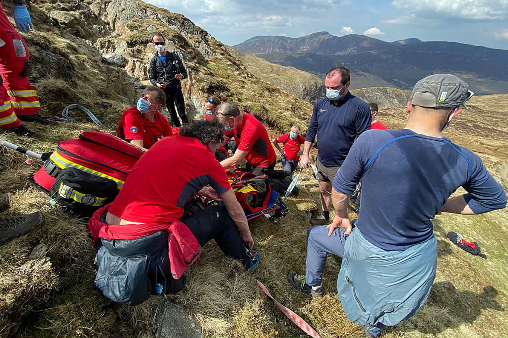 Rescuers tend to the injured walker. Photo: Keswick MRT