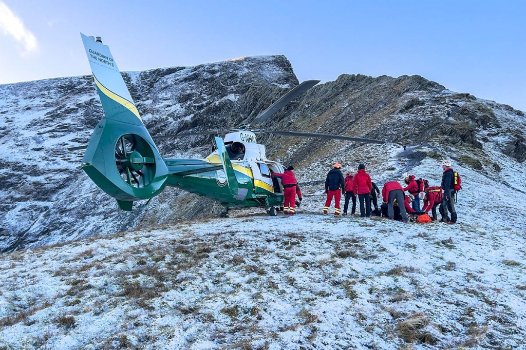 Rescuers with the Great North Air Ambulance, and Sharp Edge in the background. Photo: Keswick MRT